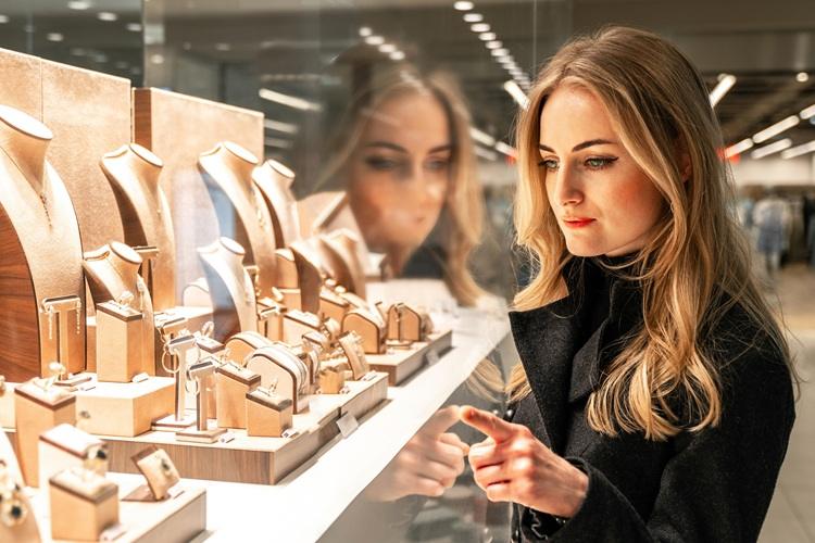 Pretty,Woman,Looking,At,Jewelry,In,Store,Window.,Customer,Near